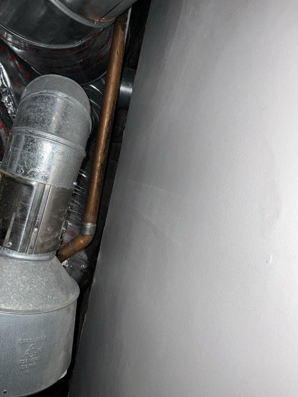 Completed comprehensive assessment of existing boiler system and provided detailed estimate for full boiler replacement and humidifier installation. Evaluated current equipment configuration including water heater/boiler unit, associated copper piping with shutoff valves, flexible ductwork, and ventilation components. Documented existing system layout with photographs showing current boiler placement, piping network, and ductwork connections to support accurate replacement specifications. Reviewed installation requirements and discussed project scope with homeowner, confirming afternoon availability for future installation work.