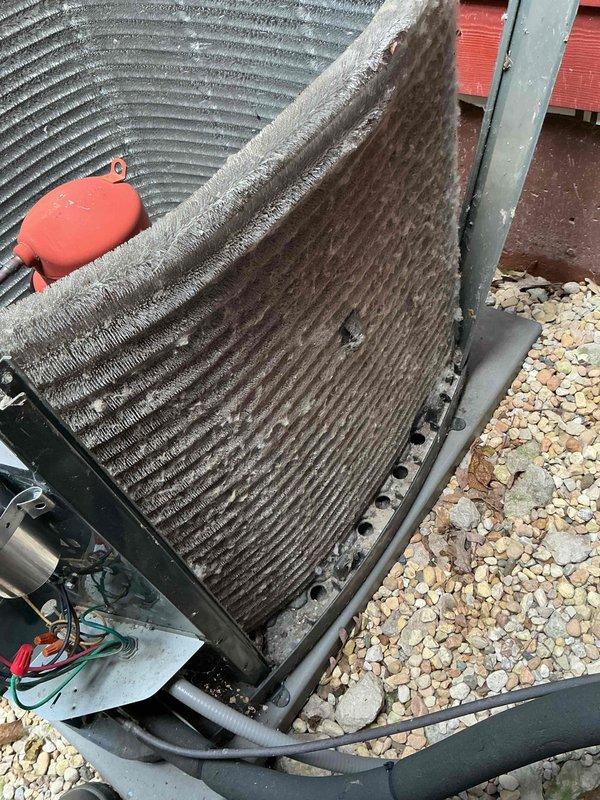 Completed comprehensive BFMA tune-up on 11-year-old air conditioning system. Upon arrival, discovered condenser coils heavily clogged with dirt, dust, lint, and debris accumulation, significantly restricting airflow and reducing system efficiency. Thoroughly cleaned condenser coils using appropriate methods to remove all accumulated contaminants from fins and heat exchanger surfaces. Performed complete system inspection including refrigerant lines, electrical connections, and capacitor. Verified proper operation of all components and restored unit to optimal performance specifications.