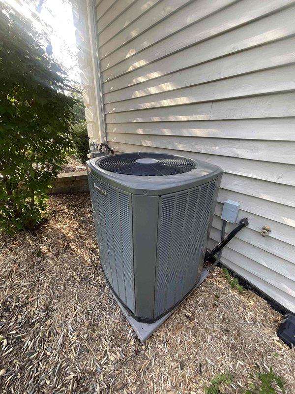 Completed installation of hard start kit, condenser fan motor replacement, and AC system renewal service on residential outdoor condensing unit. Performed electrical diagnostics with digital clamp meter to verify proper amperage draw and confirm system operation. All components tested and unit returned to normal cooling operation with improved starting efficiency and airflow performance.