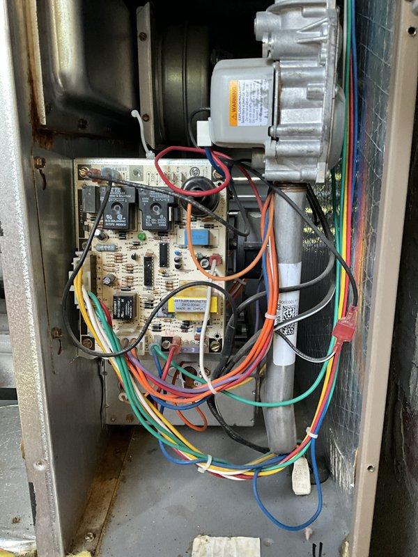 Completed comprehensive BFMA tune-up on 9+ year old air conditioning system located in utility closet on balcony. Performed full inspection of blower motor assembly, electrical components, circuit board, relays, and all wiring connections within the unit cabinet. Verified Honeywell ProSeries thermostat operation showing system in cooling mode with fan set to auto at 76 degrees with permanent hold setting active.