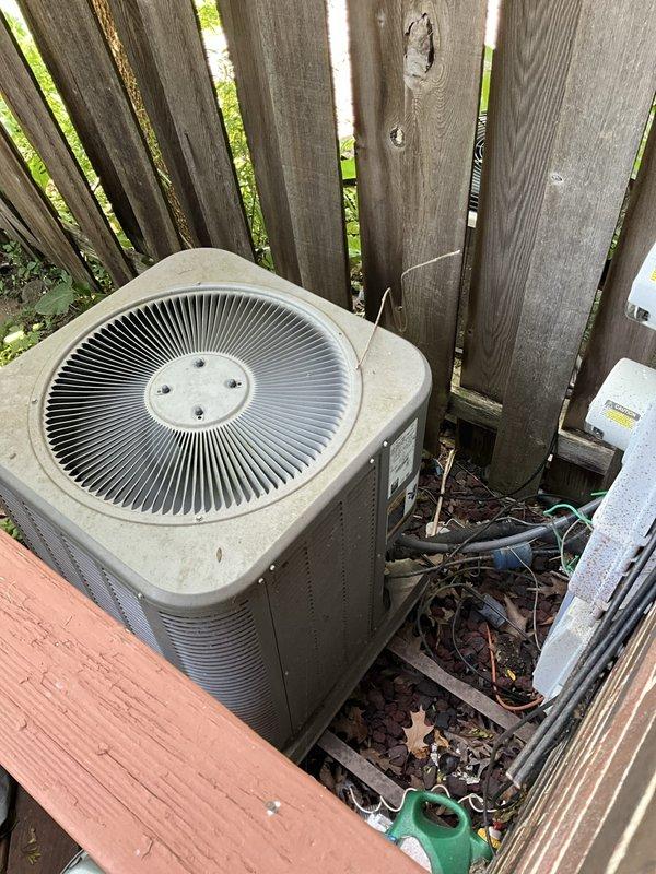 Responded to no cooling call on Lennox 13ACX-030 residential air conditioning system. Upon arrival, inspected outdoor condenser unit and verified unit specifications. System appeared to be in operational condition with no visible damage to exterior components or electrical connections. Condenser unit showed normal wear consistent with age but remained structurally sound. Cleared debris and leaves from base of unit to ensure proper airflow. Further diagnostics would be required at thermostat and indoor air handler to determine root cause of no cooling complaint and verify whether thermostat replacement is necessary or if issue lies elsewhere in the system.