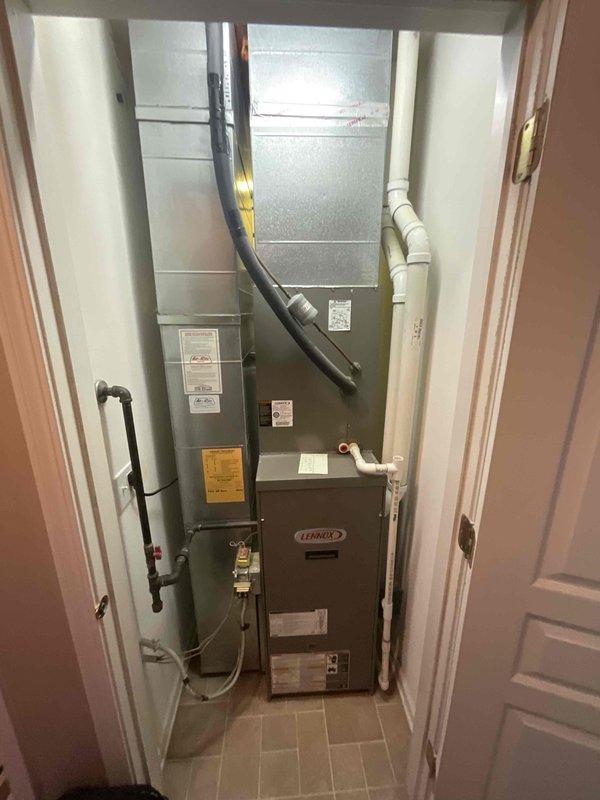 Completed full air conditioning system replacement including outdoor condenser unit and indoor evaporator coil. Removed existing equipment and installed new Lennox HVAC system in interior utility closet with proper clearances and code-compliant configuration. Mounted new outdoor condensing unit on existing concrete pad with decorative gravel landscaping, ensuring proper levelness and drainage. Connected refrigerant lines between indoor and outdoor components using appropriate insulation and routing. Installed electrical disconnect box on exterior wall with conduit run from condenser to service panel. Verified all electrical connections meet manufacturer specifications and local code requirements. Tested system startup, refrigerant charge levels, airflow measurements, and temperature differentials across coil. Confirmed proper condensate drainage from evaporator coil through existing PVC drain lines. System operating efficiently within normal parameters.