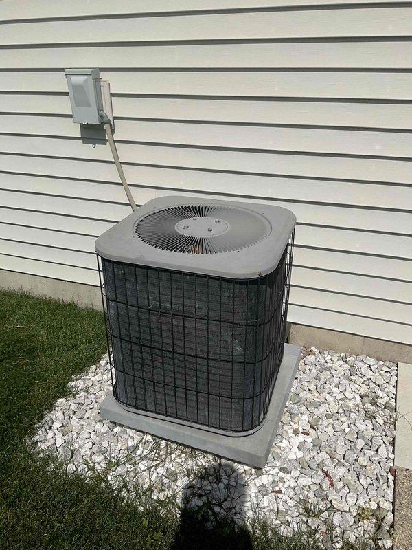 Completed full air conditioning system replacement including outdoor condenser unit and indoor evaporator coil. Removed existing equipment and installed new Lennox HVAC system in interior utility closet with proper clearances and code-compliant configuration. Mounted new outdoor condensing unit on existing concrete pad with decorative gravel landscaping, ensuring proper levelness and drainage. Connected refrigerant lines between indoor and outdoor components using appropriate insulation and routing. Installed electrical disconnect box on exterior wall with conduit run from condenser to service panel. Verified all electrical connections meet manufacturer specifications and local code requirements. Tested system startup, refrigerant charge levels, airflow measurements, and temperature differentials across coil. Confirmed proper condensate drainage from evaporator coil through existing PVC drain lines. System operating efficiently within normal parameters.