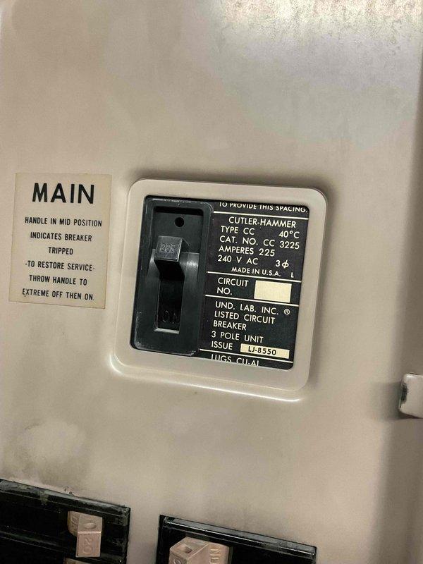 Responded to commercial no cooling complaint on rooftop unit. Upon arrival, inspected RTU and electrical components. Found main 225-amp 3-pole Cutler-Hammer circuit breaker in tripped position. Reset breaker per manufacturer instructions by switching to OFF then ON position. Verified unit startup and proper operation with normal cooling resumed.