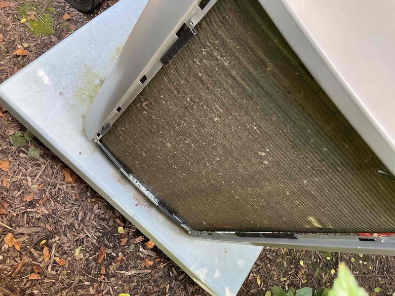 Completed comprehensive BFMA tune-up on residential air conditioning system. Upon arrival, discovered exterior filter screen heavily contaminated with organic debris, algae buildup, and significant dirt accumulation restricting airflow. Thoroughly cleaned and serviced filter assembly, removing all debris from mesh screen and housing frame. Inspected condenser unit, verified proper operation of all components, and ensured system is operating within manufacturer specifications for optimal cooling performance.