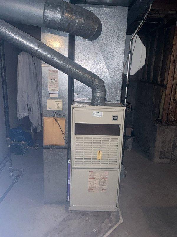 Completed full HVAC split system installation in residential basement mechanical room. Installed EL297UH090XV48CK high-efficiency furnace with CK40CT-48C coil and connected to existing ductwork distribution system. Installed ML13KC1-042 condensing unit with AA1210 refrigerant lineset and integrated Ecobee smart thermostat for system control. Added humidifier AA1210 to enhance indoor air quality. Upgraded electrical service with new 30-amp 2-pole GE circuit breaker to support system requirements. All ductwork connections secured to furnace plenum, system tested for proper airflow and operation. Equipment positioned for optimal access and serviceability in utility space with concrete floor and block wall construction.