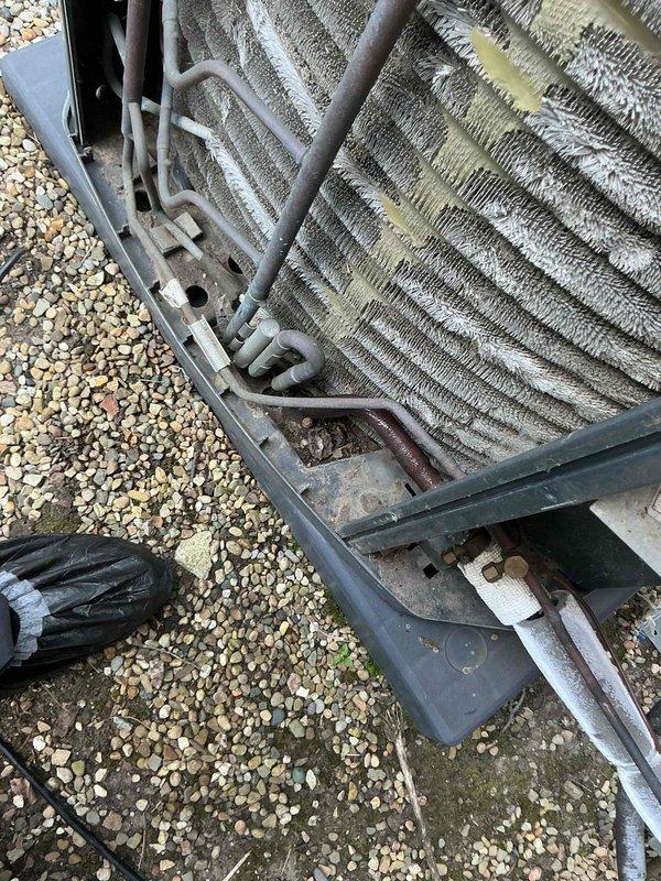 Completed comprehensive BFMA tune-up on 7-year-old air conditioning system, including inspection of outdoor condenser unit with chevron-configured coils showing moderate dirt accumulation and debris between fins. Performed electrical testing and diagnostics using multimeter to verify proper voltage and amperage readings at compressor and control circuits. Replaced 20x25x5 air filter as part of semi-annual maintenance protocol to ensure optimal airflow and system efficiency.
