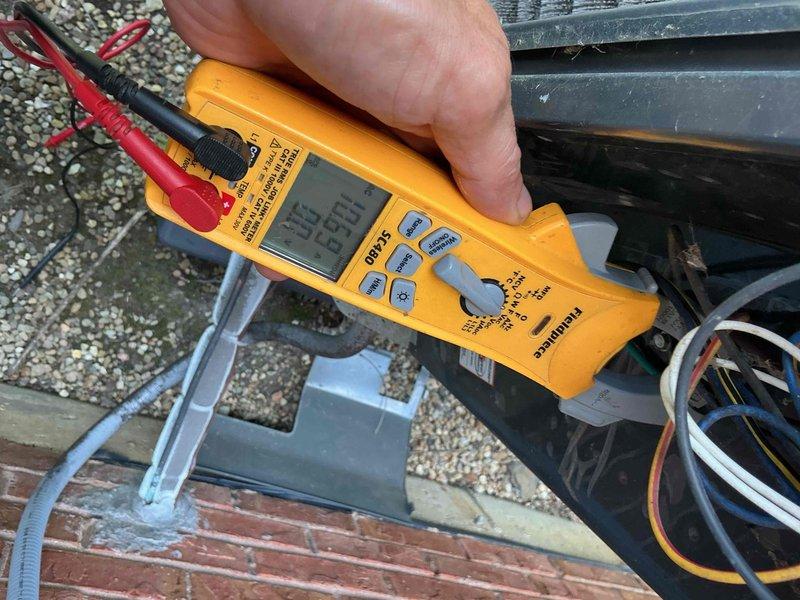 Completed comprehensive BFMA tune-up on 7-year-old air conditioning system, including inspection of outdoor condenser unit with chevron-configured coils showing moderate dirt accumulation and debris between fins. Performed electrical testing and diagnostics using multimeter to verify proper voltage and amperage readings at compressor and control circuits. Replaced 20x25x5 air filter as part of semi-annual maintenance protocol to ensure optimal airflow and system efficiency.