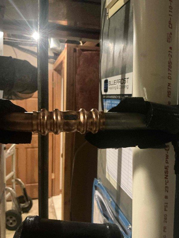 Completed warranty service on 410A AC system to address refrigerant leak at RLS fitting on recently installed evaporator coil. Replaced defective evaporator coil, installed new contactor, and added common wire to system. Evacuated and recharged system with 410A refrigerant to manufacturer specifications, verified proper operation and leak-free connections at all joints.