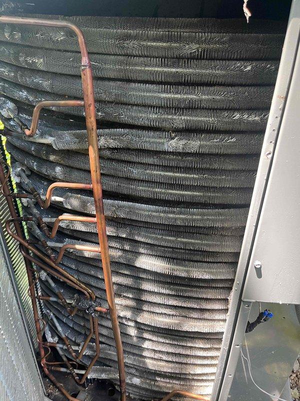 Completed comprehensive BFMA tune-up service on 4+ year old air conditioning system. Performed standard maintenance protocol including inspection of evaporator coil assembly, verified refrigerant line connections, examined condenser coil fins for debris accumulation, and inspected air filtration system with blue pleated media filter in satisfactory condition. All components operating within normal parameters upon completion of tune-up procedures.