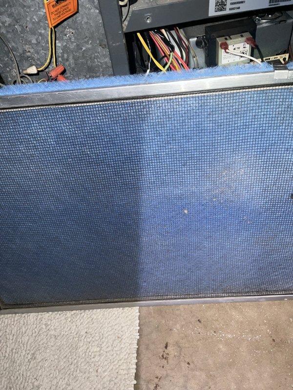 Completed comprehensive BFMA tune-up on 14-year-old residential air conditioning system during afternoon service window. Performed full system inspection of outdoor condensing unit, verified heat exchanger coil condition with minor debris accumulation between fins, confirmed protective grid integrity and secure mounting on concrete pad. Inspected indoor evaporator coil assembly, checked air filter condition showing normal dust accumulation, verified electrical connections and wiring harness integrity, and documented system components with photographic evidence for maintenance records.