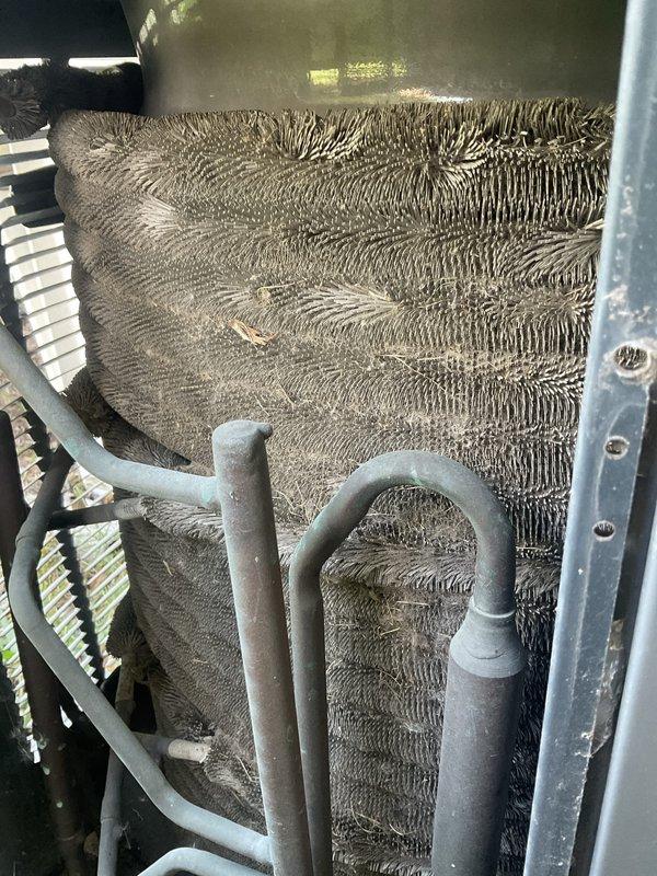 Completed comprehensive AC tune-up on 21-year-old residential cooling system. Performed standard maintenance protocol including inspection of evaporator coils, condenser coils, and refrigerant lines, all of which showed significant dust and debris accumulation consistent with the unit's age. Inspected outdoor condenser unit, electrical disconnect, and all associated components to ensure proper system operation.