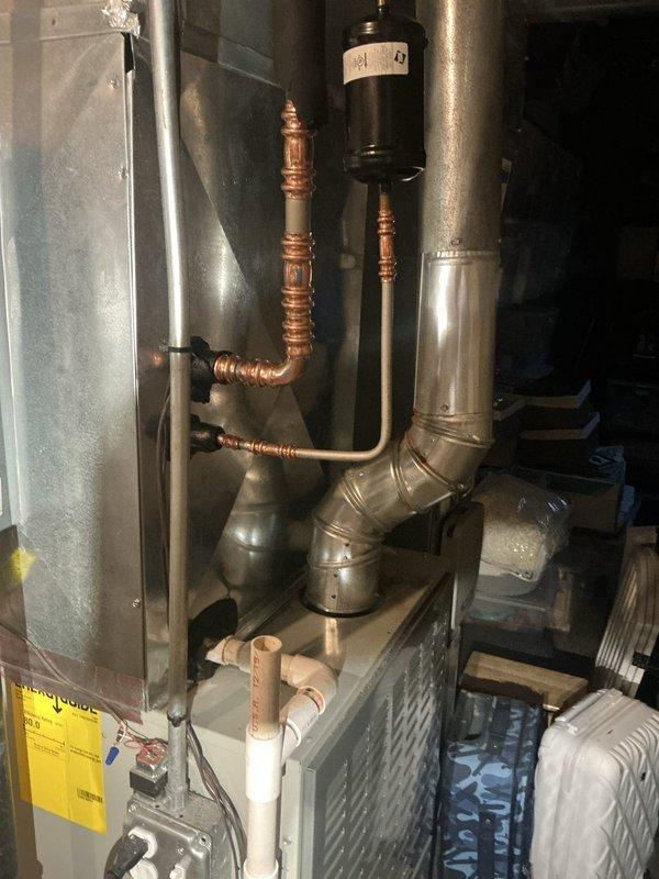 Completed full air conditioning system upgrade by installing a 5TTR6042 condenser unit and 5PXCC005AS3HA evaporator coil in basement mechanical room. Installed new 30A2P Siemens disconnect switch to meet electrical requirements for upgraded equipment. Reinstalled existing thermostat and verified proper system operation with all components functioning within manufacturer specifications.