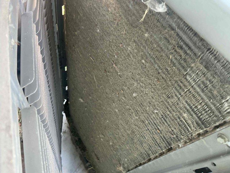 Completed comprehensive BFMA tune-up service on 18+ year old air conditioning system. Performed full system inspection, cleaned heavily soiled evaporator coil and condenser unit, removed accumulated debris and dirt buildup from outdoor unit grille and filter, checked all electrical connections, tested system operation, and verified proper airflow. Unit returned to optimal operating condition with improved efficiency.