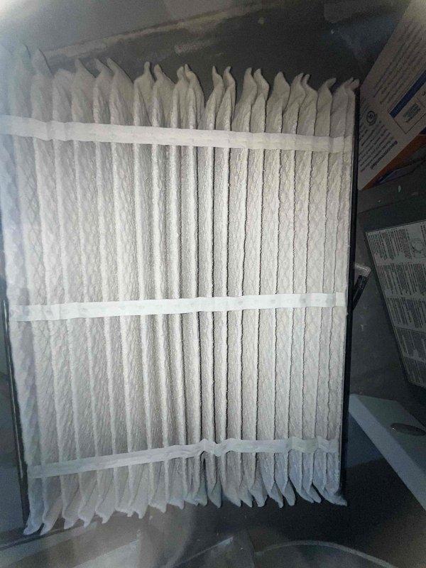 Completed comprehensive BFMA tune-up service on 7-year-old residential HVAC system, including full air conditioning inspection and preventive maintenance. Replaced pleated air filter in air handler unit and performed detailed inspection of outdoor condensing unit, accessing internal components including compressor, electrical connections, and heat exchanger coils to verify proper operation and system efficiency.