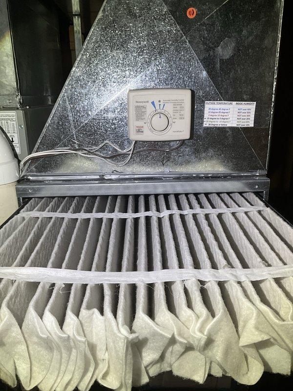 Completed comprehensive BFMA tune-up on 4-year-old residential air conditioning system. Performed full system inspection including indoor air handler with filter assessment and outdoor condensing unit evaluation. Removed exterior panel to access and inspect condenser coils, verified proper operation of all components, and documented system condition through photographic records for maintenance history.