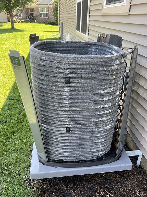 Completed comprehensive BFMA tune-up on 4-year-old residential air conditioning system. Performed full system inspection including indoor air handler with filter assessment and outdoor condensing unit evaluation. Removed exterior panel to access and inspect condenser coils, verified proper operation of all components, and documented system condition through photographic records for maintenance history.