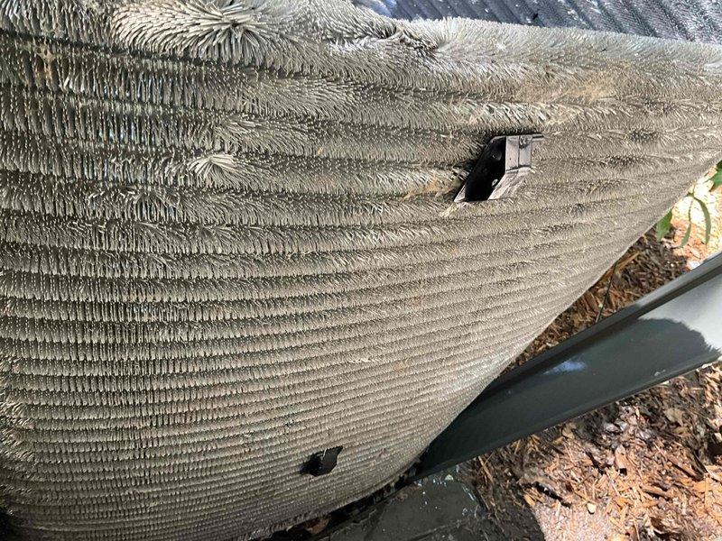 Completed comprehensive BFMA tune-up on residential air conditioning system. Performed full system inspection of outdoor condenser unit and indoor evaporator coil assembly. Evaporator coil showed moderate dust accumulation between fins and visible damage with tears in coil casing, potentially affecting system efficiency and requiring monitoring for refrigerant leaks. Condenser unit operating normally with standard weathering, properly mounted on concrete pad with secure refrigerant line connections. Documented equipment condition with photographic evidence for maintenance records.