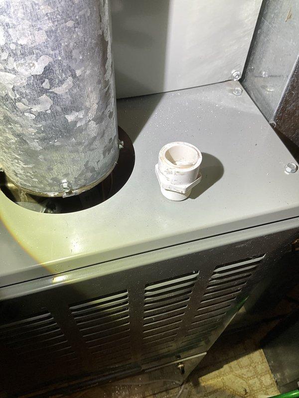 Responded to call back for water leak at furnace. Upon arrival, found PVC condensate drain pipe had snapped at connection point near furnace unit, causing active water leakage from condensate drainage system. Implemented temporary repair by securing broken PVC connection to restore drainage function and stop immediate leak. Documented equipment condition and repair with photos for follow-up permanent repair scheduling.