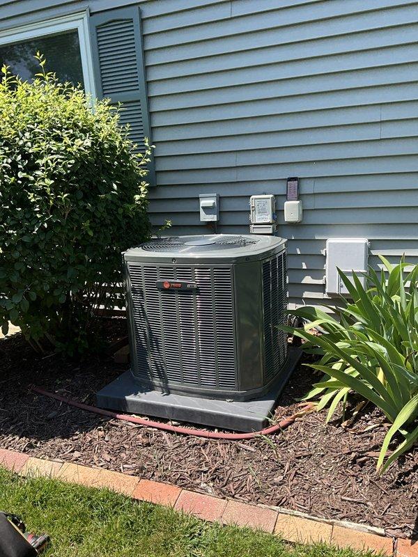 Responded to service call for air conditioning system not adequately cooling over the weekend. Customer reported unit was running and blowing air but felt like fan was only circulating without proper cooling, though system appeared to be functioning normally at time of arrival. Performed comprehensive AC service inspection on Trane outdoor condensing unit. Inspected indoor air handler and discovered heavily soiled air filter with significant dust and debris accumulation restricting airflow. Replaced dirty pleated air filter with new filter to restore proper system airflow and efficiency. Verified outdoor unit operation, checked refrigerant levels, and confirmed system is now cooling effectively with adequate airflow throughout the home.