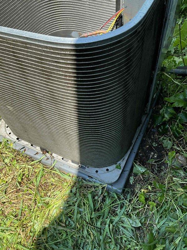 Completed comprehensive BFMA preventive maintenance tune-up on 8-year-old residential air conditioning system. Performed full system inspection of outdoor condenser unit, verified proper operation of compressor and condenser fan motor, cleaned condenser coils, checked refrigerant levels, and inspected electrical connections. Noted standing water in auxiliary drain pan which was addressed, and observed minor vegetation growth around unit base that may require future attention to maintain adequate airflow clearance around equipment.