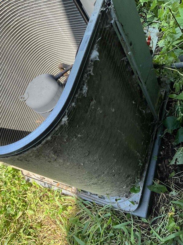 Completed comprehensive BFMA preventive maintenance tune-up on 8-year-old residential air conditioning system. Performed full system inspection of outdoor condenser unit, verified proper operation of compressor and condenser fan motor, cleaned condenser coils, checked refrigerant levels, and inspected electrical connections. Noted standing water in auxiliary drain pan which was addressed, and observed minor vegetation growth around unit base that may require future attention to maintain adequate airflow clearance around equipment.