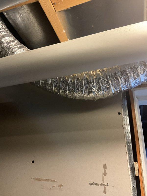 Responded to service call regarding slow drip observed at two locations near basement ductwork. Performed thorough inspection of HVAC system including attic installation, ductwork, and condensate drainage components. Examined flexible duct connections, metallic ductwork transitions, and all visible piping systems including copper refrigerant lines and condensate drain lines. Verified proper insulation on refrigerant lines and checked for signs of excessive condensation on duct surfaces. Inspected condensate drain system for proper pitch and drainage, cleared any potential blockages, and confirmed drain line integrity. Assessed system operation under current high ambient temperature conditions and verified thermostat settings. Explained to homeowner that condensation on ductwork and associated components is normal during periods of high humidity and temperature differential, particularly when maintaining lower indoor temperatures. Recommended monitoring the drip locations and provided g
