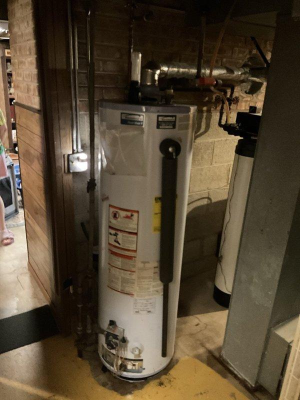 Responded to no hot water complaint following recent storm activity. Performed diagnostic inspection of Kenmore Power Miser 9 tanked water heater located in basement utility area. Assessed electrical connections, plumbing connections, temperature and pressure relief valve, and heating elements to determine cause of failure and restore hot water service to residence.