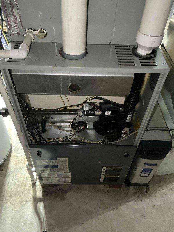 Completed sales estimate for air conditioning system replacement after customer experienced one-week outage. Customer specifically requested American Standard two-stage Gold series equipment, which was confirmed as available for installation. Assessed existing furnace unit with internal blower motor assembly, PVC venting system, and galvanized ductwork in mechanical room to determine compatibility and installation requirements for new AC and coil system.