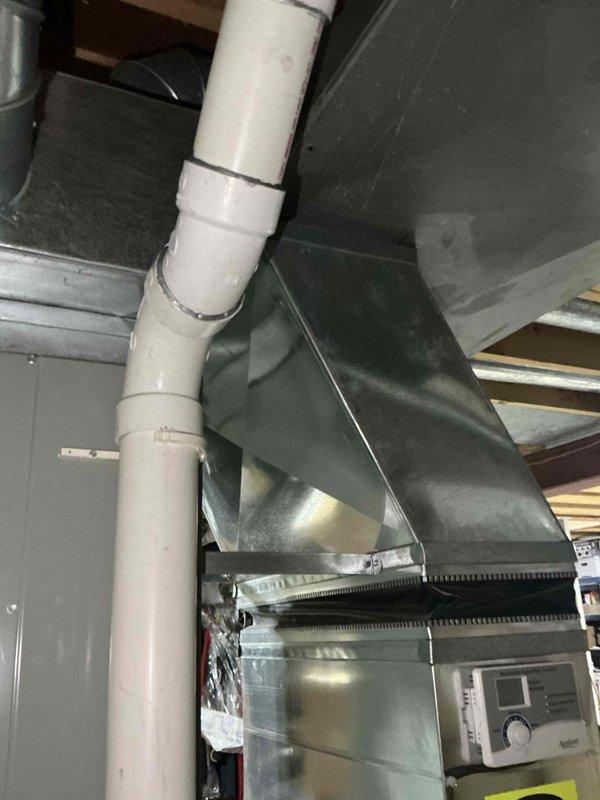 Completed sales estimate for air conditioning system replacement after customer experienced one-week outage. Customer specifically requested American Standard two-stage Gold series equipment, which was confirmed as available for installation. Assessed existing furnace unit with internal blower motor assembly, PVC venting system, and galvanized ductwork in mechanical room to determine compatibility and installation requirements for new AC and coil system.