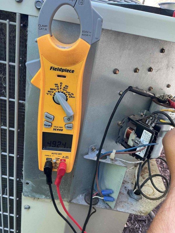 Completed comprehensive BFMA tune-up service on residential air conditioning system. Performed electrical diagnostics using clamp meter to verify amperage draws and system performance, inspected and tested dual-run capacitor (60+5μF) and contactor assembly, evaluated all electrical connections and wiring integrity within control panel. System operational with all components functioning within normal parameters.