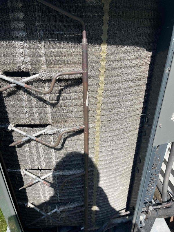 Completed comprehensive BFMA tune-up on 9+ year old air conditioning system, including inspection of condenser unit with aging coils showing oxidation on copper refrigerant lines and varying fin conditions. Replaced air filter with new pleated media filter and verified proper system operation. All components inspected and system returned to optimal performance for continued reliable cooling.