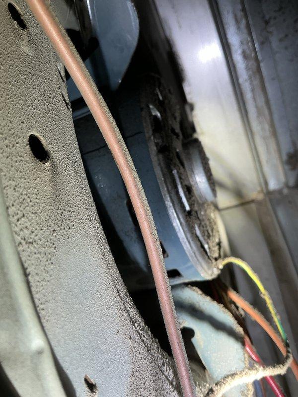 Responded to residential no cooling call where client suspected blower motor failure. Upon inspection of the air handler unit, verified blower motor operation and found system airflow was restricted due to accumulated debris and dust buildup on the return air grate and surrounding ductwork. Cleaned return air louvers and inspected electrical connections, which showed normal operation. Verified proper voltage to blower motor and confirmed unit cycling correctly. System restored to normal cooling operation with adequate airflow throughout.
