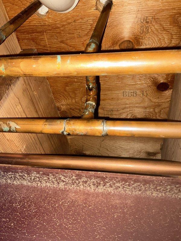 Completed comprehensive BFMA tune-up service on a 7+ year old air conditioning system. Performed full system inspection including refrigerant line assessment, ductwork evaluation, and verification of all mechanical components in attic space. All copper refrigerant lines, service ports, and galvanized ductwork were inspected and found to be operational with system running within manufacturer specifications.