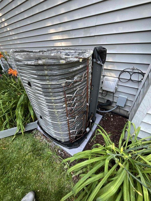 Completed comprehensive BFMA tune-up service on residential air conditioning system with one-year-old equipment. Performed standard maintenance protocol including inspection of outdoor condenser unit, verification of electrical connections and disconnect box, and examination of interior ductwork components. Observed moderate dust accumulation within coiled ductwork assembly and routine weathering on exterior condenser fins, with all mechanical components functioning within normal parameters upon completion of tune-up procedures.