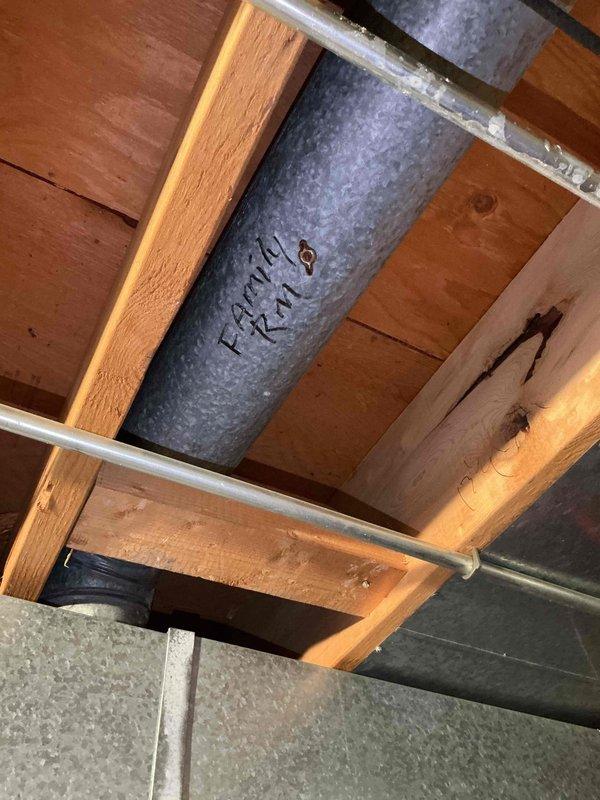 Responded to customer concerns regarding thermostat malfunction and uneven temperature distribution throughout the home, with the family room experiencing excessive cooling. Upon inspection, accessed attic space and examined the ductwork system, including main supply ducts and branch lines serving affected areas. Documented existing HVAC infrastructure conditions, including galvanized metal ductwork routing, insulation placement, and cable management within the ceiling cavity. Verified proper airflow distribution and identified potential issues contributing to temperature imbalances between rooms.