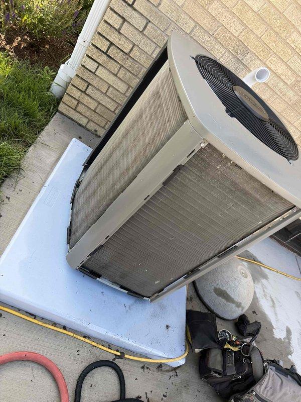 Completed comprehensive BFMA tune-up service on residential air conditioning system. Performed full system inspection of outdoor condensing unit, including visual assessment of cabinet condition, refrigerant line connections, and electrical disconnect. Checked compressor operation, verified proper fan motor function, and inspected condenser coil for debris accumulation. Measured system pressures and temperatures to ensure optimal refrigerant charge and system performance. Cleaned condenser coil surfaces and removed debris from unit exterior and surrounding area. Verified proper drainage, inspected electrical connections for tightness and signs of wear, and confirmed unit is operating within manufacturer specifications. System is functioning properly with no immediate service needs identified.