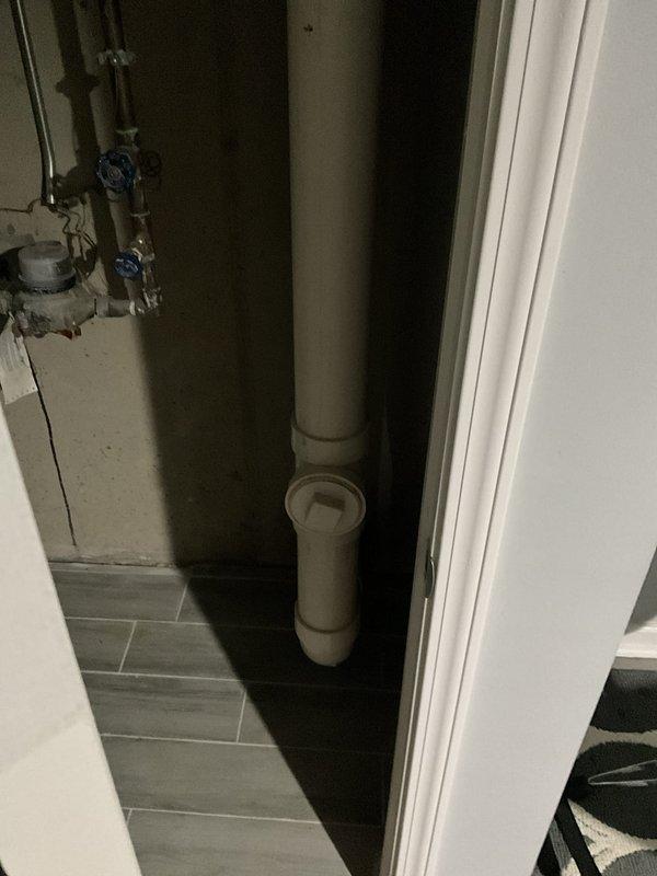 Completed comprehensive plumbing inspection for landlord, documenting water supply system including main shutoff valves, water meter assembly, and vertical drainage piping. All copper supply lines, galvanized pipes, gate valves, and PVC drain stack with cleanout fitting were photographed and assessed for proper operation and condition.