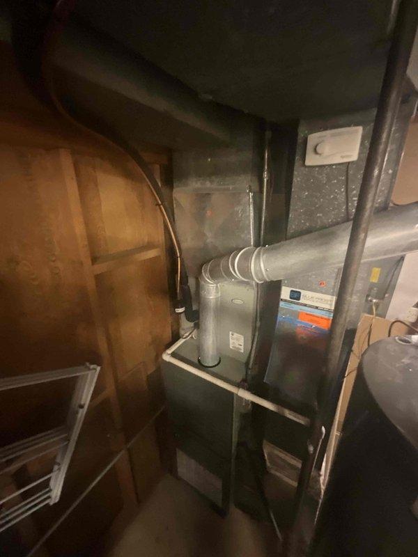 Completed comprehensive BFMA tune-up on 10+ year old residential air conditioning system. Performed full inspection and maintenance of outdoor condenser unit, including cleaning of heat exchanger coils which showed moderate accumulation of dirt and debris on fins, and verified proper operation of fan assembly and compressor. Inspected indoor air handler components in mechanical room, checked humidifier system operation, and verified all electrical connections and controls functioning within normal parameters.