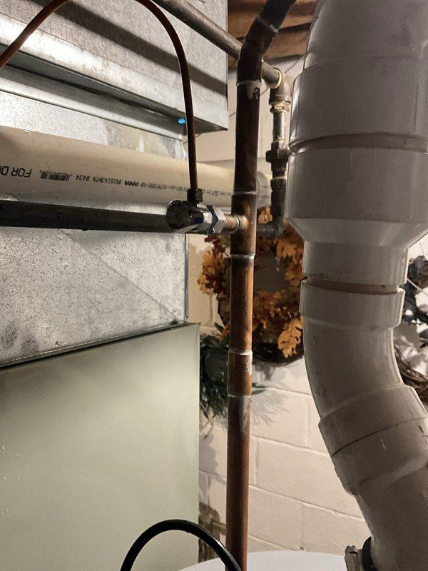 Responded to water leak complaint and successfully replaced defective angle stop valve on copper supply line. The existing valve exhibited significant corrosion and deterioration, which was causing the leak at the connection point. Shut off main water supply, removed the failed angle stop, cleaned and prepared the copper pipe connection, and installed new angle stop valve. Restored water service, tested the new installation for proper operation and verified no leaks present. System returned to full functionality.