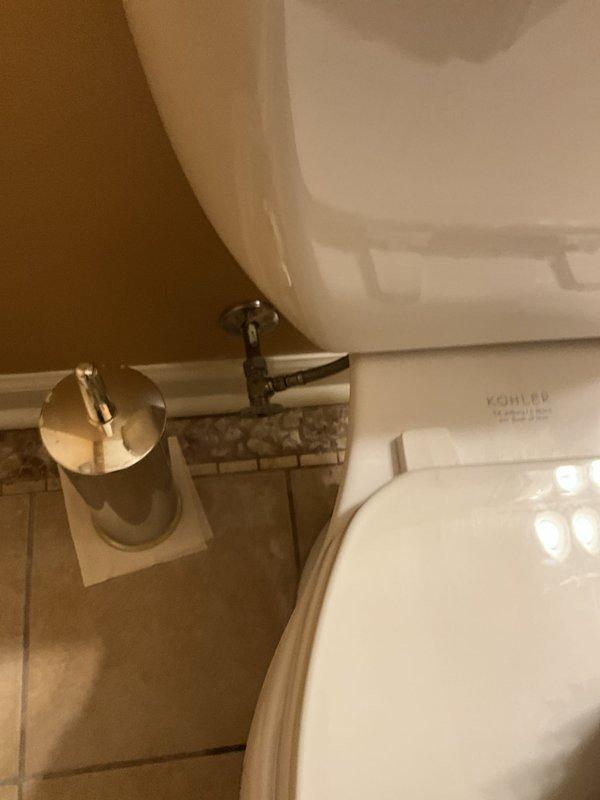 Completed comprehensive plumbing tune-up and complimentary inspection of residential plumbing system. Inspected bathroom fixtures including Kohler toilet, chrome supply line, and paper holder mounting, confirming proper operation and no visible leaks. Evaluated water pressure regulation system, verifying Mid-West Watts pressure gauge reading within acceptable range and inspecting brass fittings, copper supply lines, and water heater connections for proper function and potential issues.