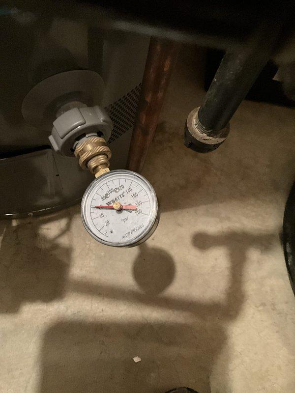 Completed comprehensive plumbing tune-up and complimentary inspection of residential plumbing system. Inspected bathroom fixtures including Kohler toilet, chrome supply line, and paper holder mounting, confirming proper operation and no visible leaks. Evaluated water pressure regulation system, verifying Mid-West Watts pressure gauge reading within acceptable range and inspecting brass fittings, copper supply lines, and water heater connections for proper function and potential issues.