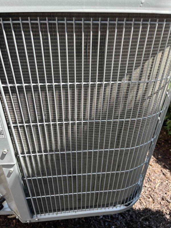 Completed comprehensive air conditioning tune-up on a 5-year-old residential cooling system. Performed thorough inspection of outdoor condenser unit, verifying proper operation of compressor, condenser fan motor, and electrical components. Checked refrigerant pressures and temperatures to ensure system is operating within manufacturer specifications. 

Inspected condenser coil fins for damage and debris accumulation, finding unit in good condition with clean aluminum fins and protective grille guard intact. Verified adequate clearance around outdoor unit and proper drainage. Tested capacitor values and electrical connections for safe operation.

Inside the residence, inspected the air handler and evaporator coil assembly. Evaluated the existing air filter condition and confirmed proper airflow through the system. Checked condensate drain line for blockages and proper drainage. Verified thermostat operation and calibration for accurate temperature control.

Measured temperature split ac