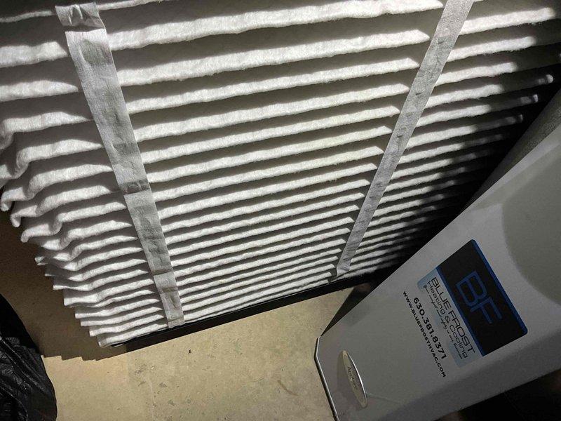 Completed comprehensive BFMA tune-up on a 5-year-old air conditioning system, including full system inspection and preventive maintenance. Inspected air handler unit, verified proper operation of control boards and electrical connections, examined blower motor assembly with digital controls, and confirmed all wiring connections were secure. Assessed pleated air filter condition within the metal frame housing and inspected interior components for optimal performance and efficiency.