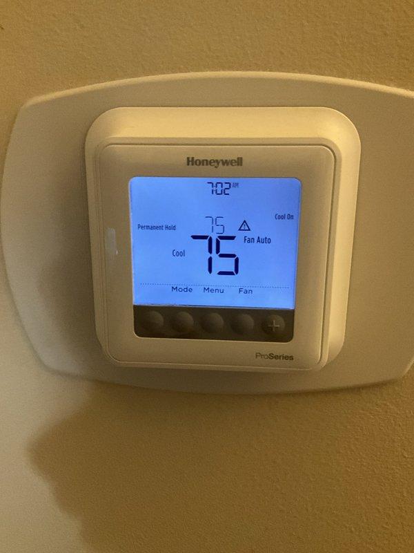Completed comprehensive BFMA air conditioning tune-up on 8-year-old system. Performed full system inspection including thermostat verification, blower assembly examination, and standard preventative maintenance procedures. Verified Honeywell ProSeries thermostat operation at 75°F cooling setpoint with proper system response, inspected blower wheel assembly for cleanliness and proper operation, and confirmed all mechanical components functioning within normal parameters.