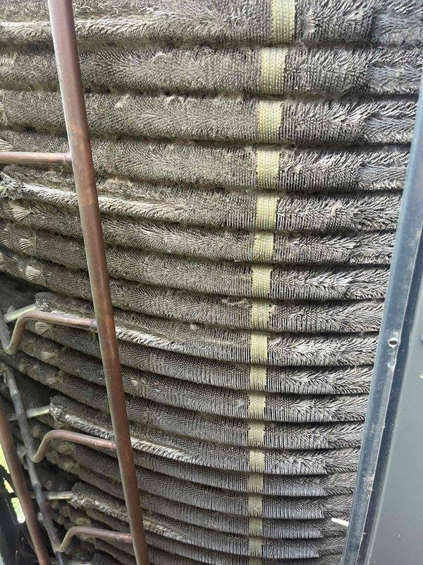 Completed comprehensive BFMA tune-up service on residential Trane air conditioning system aged 5+ years. Performed full system inspection of outdoor condenser unit and indoor evaporator coil assembly, noting significant dirt and debris accumulation on evaporator coil fins that was restricting airflow and reducing heat exchange efficiency. Cleaned coil surfaces, checked refrigerant lines and connections, verified fan operation, and restored unit to optimal operating condition.