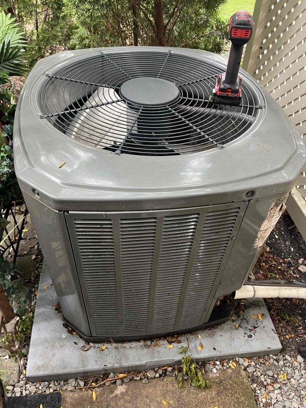 Performed comprehensive BFMA tune-up on residential air conditioning system at townhome property. Completed full inspection of outdoor condenser unit including condenser coil cleaning, refrigerant line inspection, and fan motor operation verification. Removed debris accumulation from base pan and coil assembly, tested electrical connections, and confirmed proper system operation with all components functioning within manufacturer specifications.