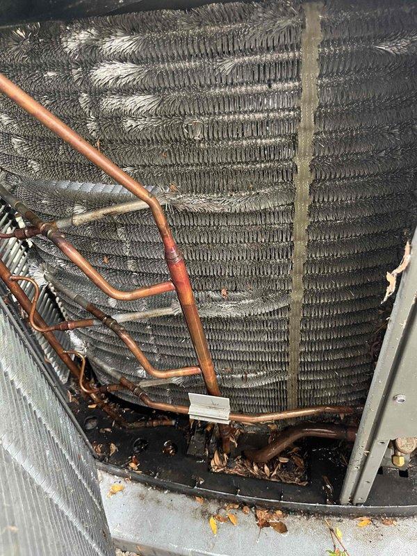 Performed comprehensive BFMA tune-up on residential air conditioning system at townhome property. Completed full inspection of outdoor condenser unit including condenser coil cleaning, refrigerant line inspection, and fan motor operation verification. Removed debris accumulation from base pan and coil assembly, tested electrical connections, and confirmed proper system operation with all components functioning within manufacturer specifications.