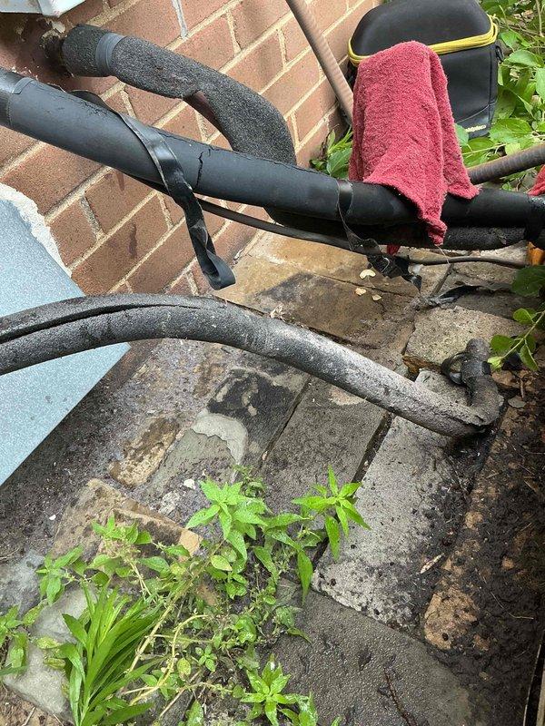 Responded to no cooling call following previous blower motor replacement. Upon arrival, found system powered off and refrigerant lines disconnected outside unit. Reconnected refrigerant line set, evacuated system, and recharged to manufacturer specifications. Verified proper airflow through indoor unit and confirmed blower motor operation. Tested system operation with successful cooling cycle and proper temperature differential across evaporator coil.