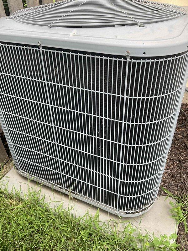 Performed routine cooling system tune-up and inspection on residential air conditioning unit. Conducted comprehensive evaluation of outdoor condenser unit, which was found to be in good operational condition with clean coils, intact protective fan grille, and no visible signs of damage or deterioration. System operating properly with no issues identified during inspection.